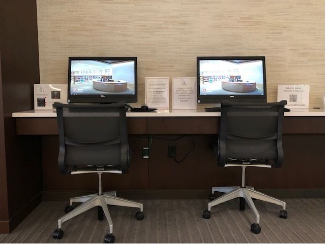 Two computers and office chairs